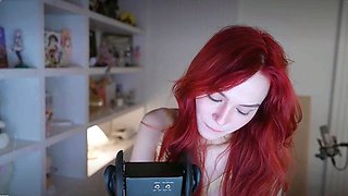 Redheaded pierced teen close up toy show