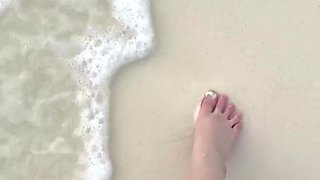 Running My Bare Feet on the White Beach Sand by the Ocean