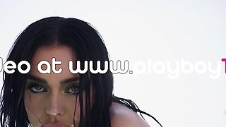 Classy beauty relaxing naked by the pool