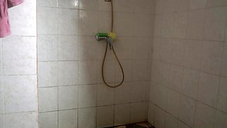 Ebony babe soaps up under the spray then takes it against the tiles
