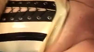 Horny latex MILF loves a warm load on her face