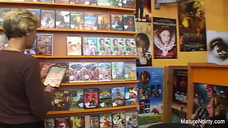 Sexy blonde mature fucks him in the video store
