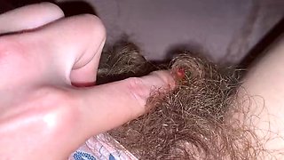Closeup of huge clit head and hairy pussy