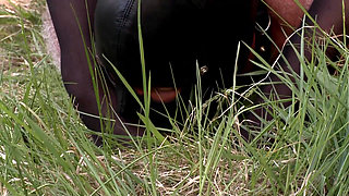 Herrin enslaves man and enjoys foot fetish outdoor