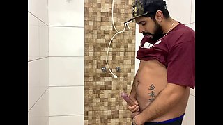 Squirting cum, bearded man with a cap alone in the bathroom having fun in the handjob until he cums a lot - Rodrik Dick