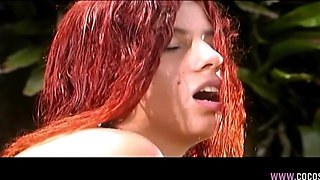 Redhead and Brunette Lesbians Pleasure Each Other Outdoors