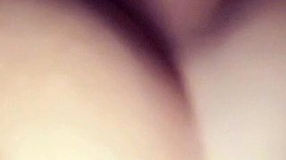 A super sexy brunette massages her big boobs