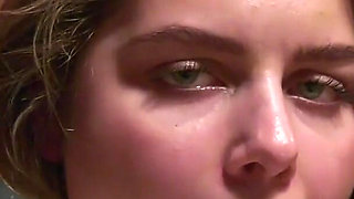 Leya is tied on a chair and drools through ballgag