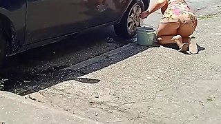 HOT GIRL WASHES HER CAR SHOWING OFF ON THE STREET