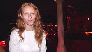 Redheaded minx teases in a club before stripping down for an unforgettable BJ