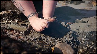 Feet In The Sand At The Beach