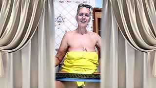 Cheerful Housewife Lukerya Shows Her Bare Feet in Kitchen. Mature Soles and Toes Close Up