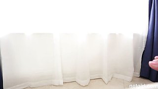 Jade pineapple-tattoo doggy looks back hard on the white tufted couch