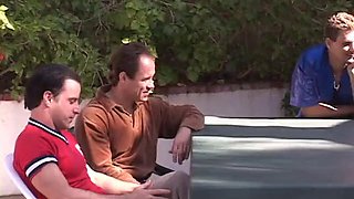 Horny black haired beauty sucks and fucks four men by the pool