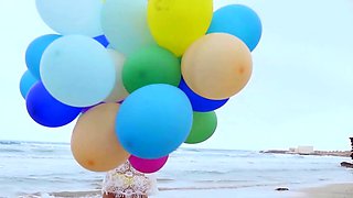 Sexy naked MILF playing with her baloons