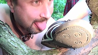 Slave licks clean dirty shoes