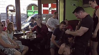 Publicly humiliated sub sucking cock with voyeurs watching