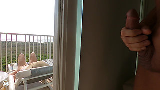 Sunning on the balcony in plain view of everyone walking by