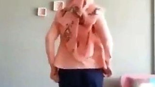 Turkish Arab in Hijab and Turban Performs a Striptease