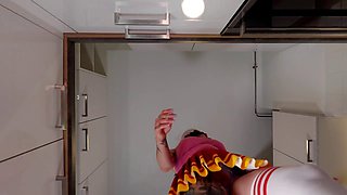 Smoking hot ginger-haired cheerleader shows off her see-through panties in the kitchen while wearing over-the-knee socks