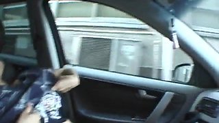 Busty MILF masturbates in solo car scene