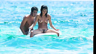 Sexy naked teens play together at a public beach