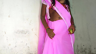 I am an Indian woman ready to have sex while wearing a pink Indian saree.