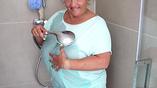 Mature Brunette with Massive Tits Gets Steamy in the Shower