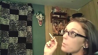 Hot brunette gets a mouthful of hot cum while smoking..
