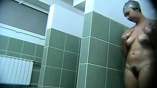 Hot busty on a voyeur video from the swimming pool showers