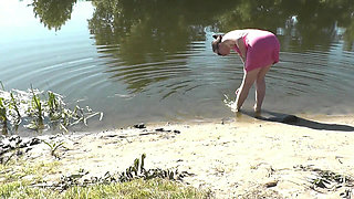 Beautiful Cute Girl Assol Sunbathes on River Bank on Wild Beach in a Dress Without Panties and Naked in Public Outdoors Outside
