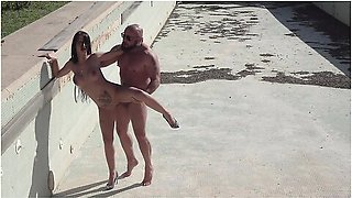 The Real Estate Agent First Tests The Buyers Hard Cock In The Empty Pool And In The Garden Before A Second One Joins In