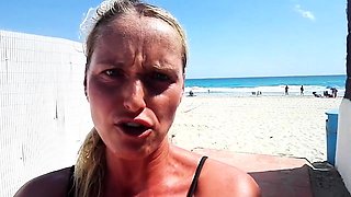 Outdoor solo masturbation scene with curly blonde